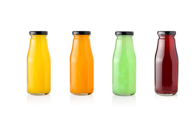 Set of fruit juices in glass bottles isolated on white background.