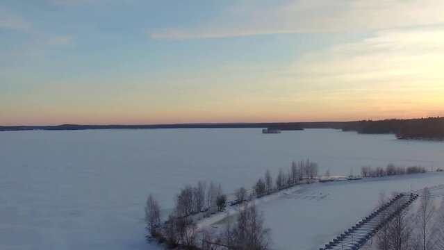 Aerial view of frozen lake Pirkanmaa, boat harbour and winter scenery of Nokia, Finland.