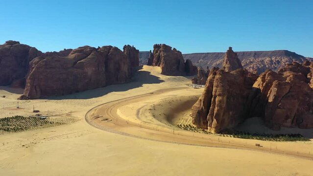 Aerial view of a road and mountains in Ashar park, Saudi Arabia - circling, drone shot