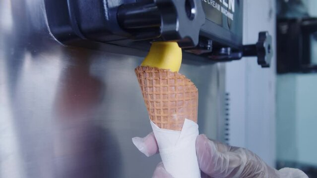 Ice cream machine for cooking and making delicious mango ice cream. closeup shot. normal speed