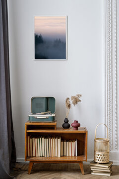 Retro style decor, books and vinyl player in room