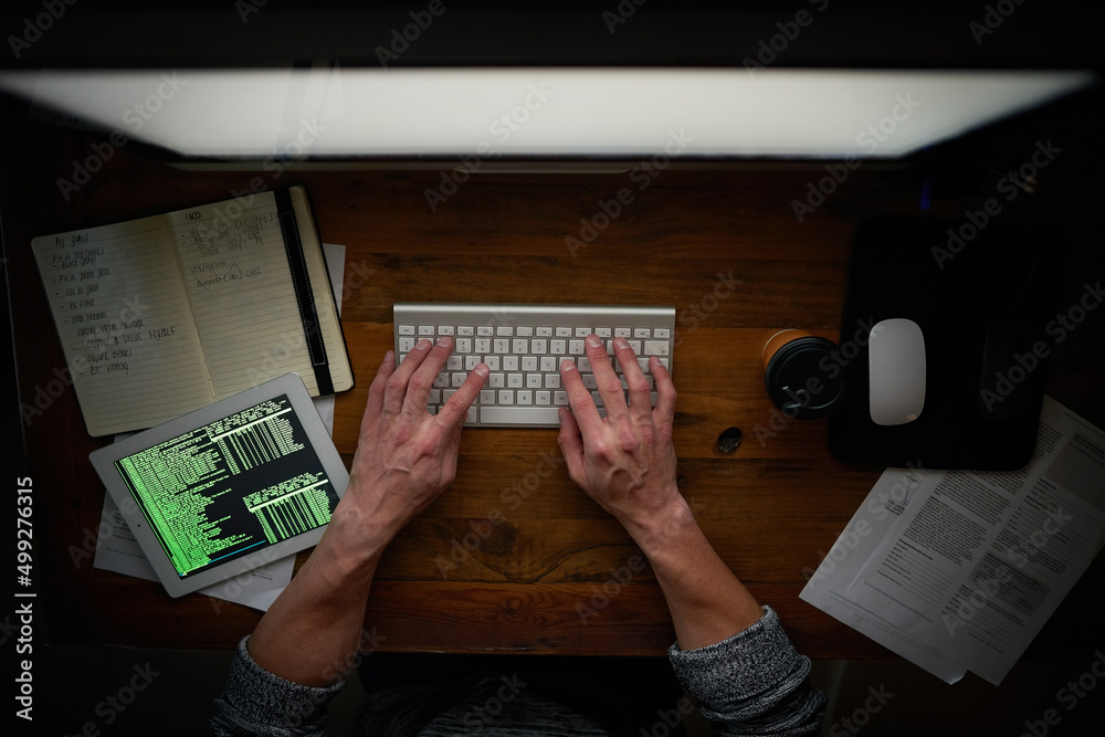 Aufkleber Making it work, no matter the hour. High angle shot of an unidentifiable computer programmer working alone late at night.