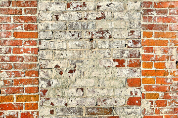 The background is made of old old red brick and peeling plaster