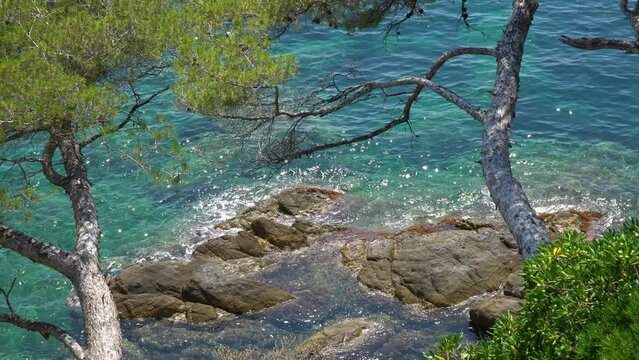 Beautiful view of the azure coast - French Riviera. Azure waves touch the sharp and beautiful French rocks.