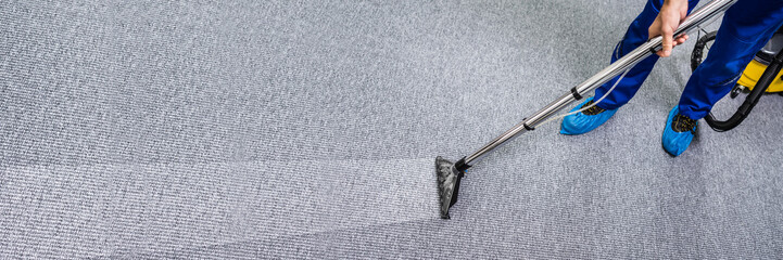 Person Cleaning Carpet With Vacuum Cleaner - obrazy, fototapety, plakaty