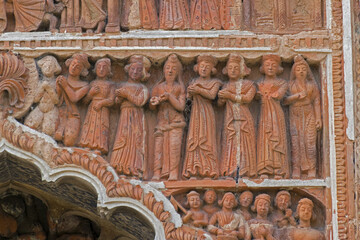 Terracotta decorations on the walls at Pratapeswar Temple at Kalna, West Bengal, India. Terracotta is a brownish-red clay that has been baked and is used for making things.