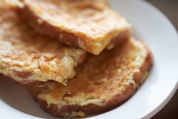 Close-up of delicious egg sandwiches in a white plate. The concept of a quick breakfast