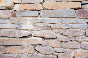 antique masonry. stone wall of the house or fence.