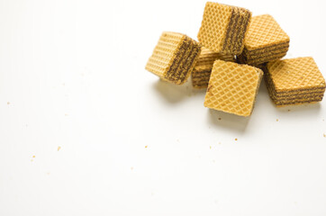 Cube wafer with chocolate cream on isolated white background