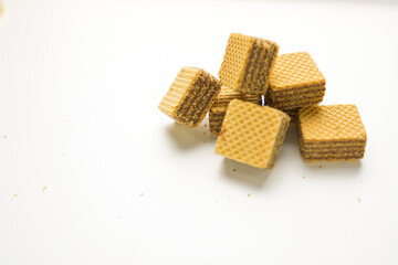 Cube wafer with chocolate cream on isolated white background