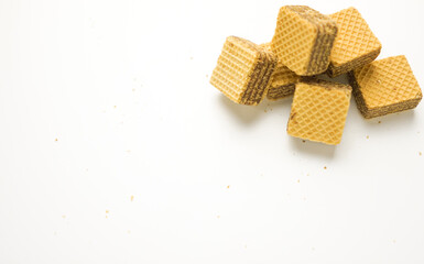 Cube wafer with chocolate cream on isolated white background