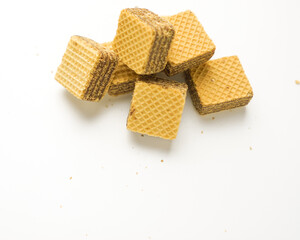 Cube wafer with chocolate cream on isolated white background
