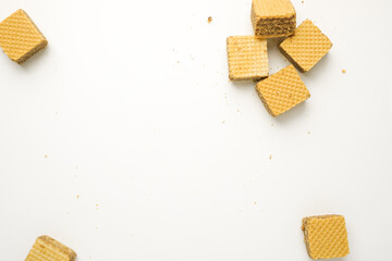 Cube wafer with chocolate cream on isolated white background