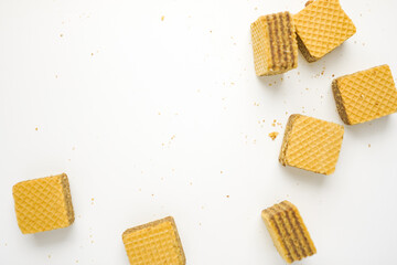 Cube wafer with chocolate cream on isolated white background