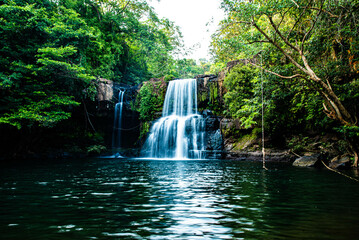 Fototapeta na wymiar Waterfall on Koh Kood named Klong Chao Waterfall is a beautiful waterfall on the island of Thailand.