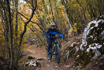 Fototapeta na wymiar Mountain biker riding on bike in nature.