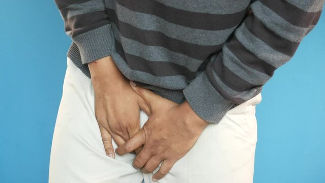 the concept of prostate and bladder problem, crotch pain of a young person 