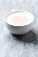 Coffee with milk on wooden background. Close up. Copy space.	
