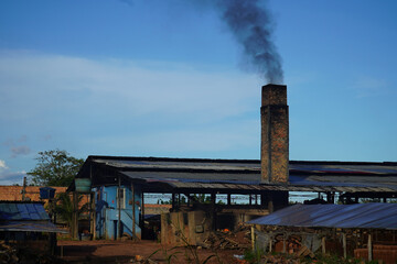 Old factory chimney of a brickyard in the Amazon region of Brazil. The circular kiln is operated...