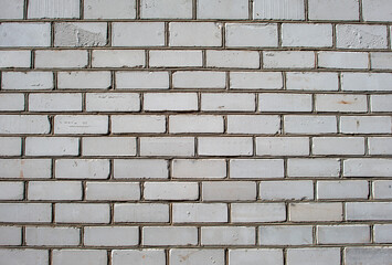 Lined wall of white sand-lime brick