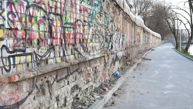 Brick wall painted with graffiti
