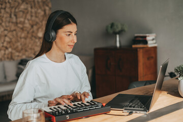 girl creation and listen music in grey headphones