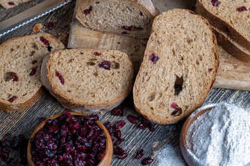 fresh cut bread made of flour and dried cranberries
