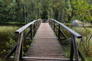 Obraz premium Wooden bridge over the river in Finland