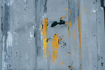 The texture of the brick wall is covered with old paint