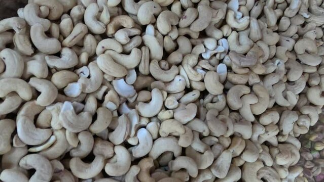 Heap of Cashew Nuts or Kaju Badam .Smooth Movement of a pile of cashew nuts, without shells