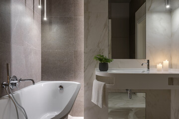 bathroom interior, stylish modern bathroom with gray and white tiles