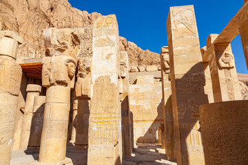 Hathor capital columns in Mortuary Temple of Hatshepsus at the cliffs of Deir el Bahari in Valley of The Kings, Luxor, Upper Egypt.