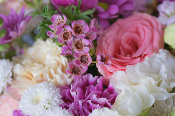 Decorative bouquet of many different small and large flowers