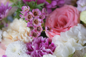 Decorative bouquet of many different small and large flowers