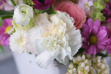 Decorative bouquet of many different small and large flowers