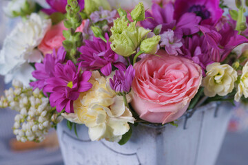 Decorative bouquet of many different small and large flowers