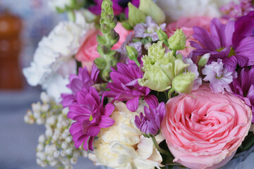 Decorative bouquet of many different small and large flowers