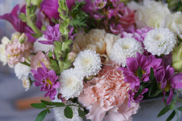 Decorative bouquet of many different small and large flowers