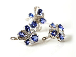 earring and ring set with big blue tanzanite and white diamonds around, jewerly shop, pawnshop concept