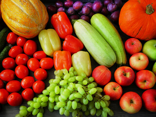 many different fruit and vegetables, green glocery shop, healthy fresh colored fruits and vegetables background delivery