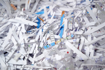 Shredded documents to protect confidential information, background, top view