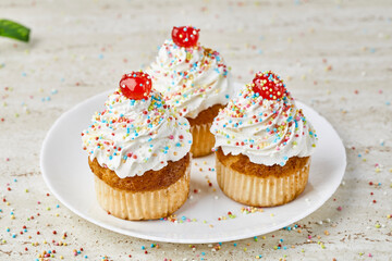 Delicious freshly baked homemade cupcakes, with cream, pralines