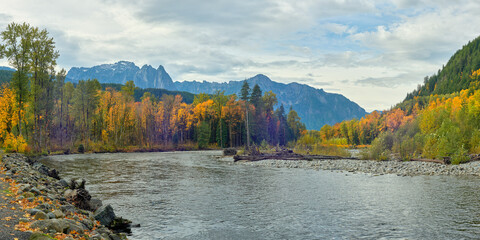 Scenic panorama with mountain river and autumn yellow trees in central Washington state.