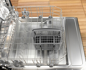 Empty dishwasher open door, showing baskets