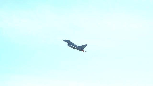 Eurofighter Typhoon military aircraft part of the Italian Air Force flying against blue sky. Military industry. Romania, 2022.