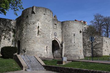 View of Port Gayole gate house and the medieval ramparts of Boulogne-sur-mer, in the Pas de Calais region of northern France. Sunny spring day with blue sky. - obrazy, fototapety, plakaty