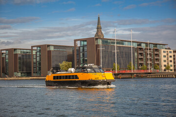 Yellow public transportation boat bus in Copenhagen, Denmark