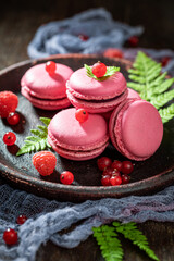 Homemade and sweet red currant macaroons as a spring snack.