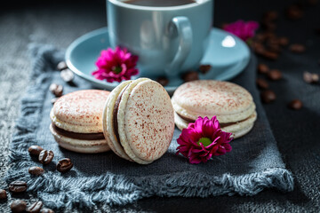 Tasty and sweet coffee macaroons as a brown dessert.