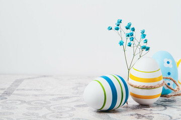 Fototapeta premium Easter. Multicolored eggs. Yellow and blue Easter decorations.